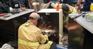 Firefighters disassemble safe to free woman after three long hours.